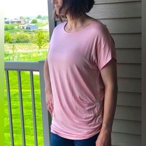 Light pink tshirt with button detail on side